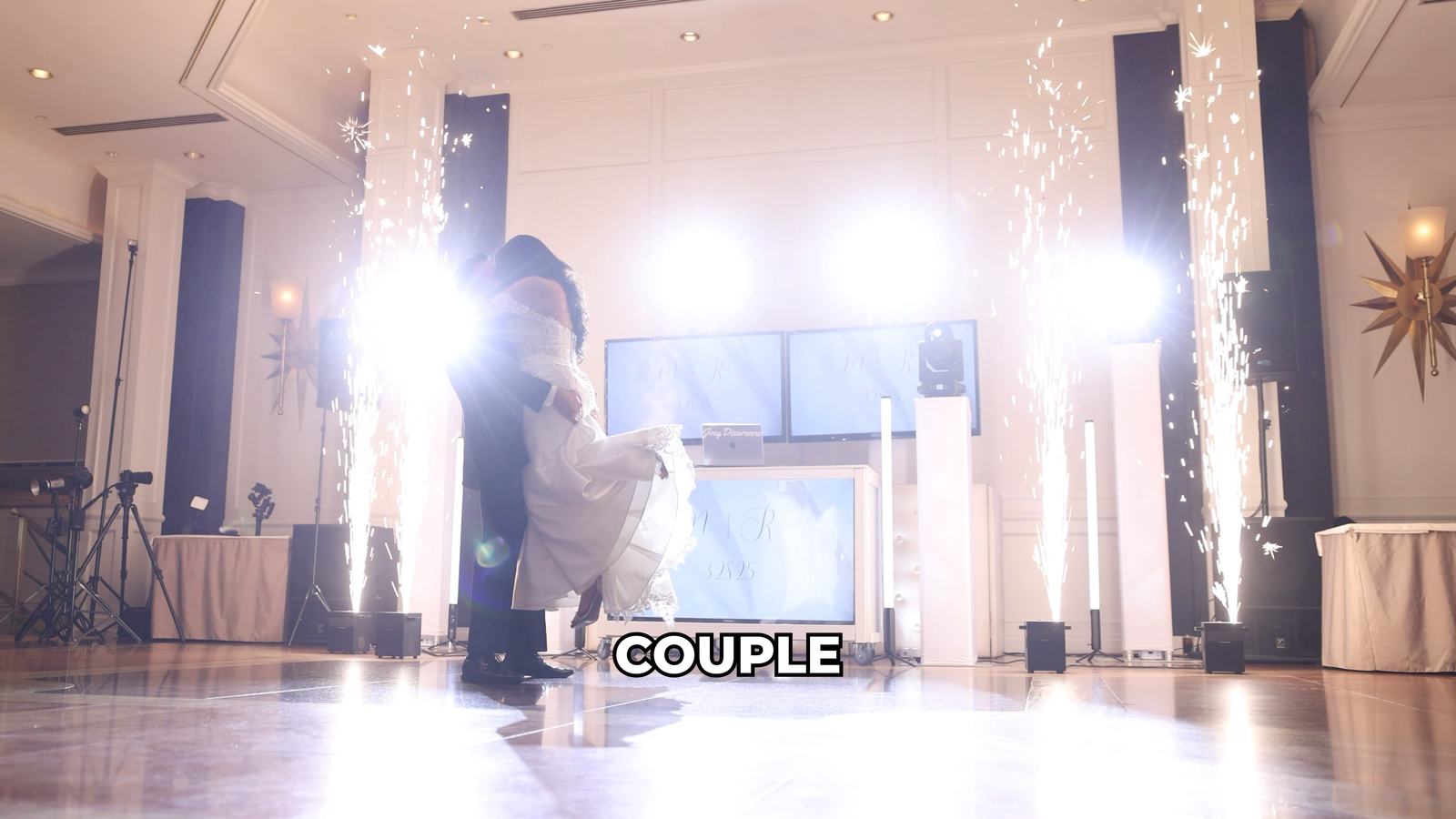 Cold spark fountains firing on both sides of the dance floor at Glen Island Harbour Club, with the DJ booth and dual LED screens centred behind